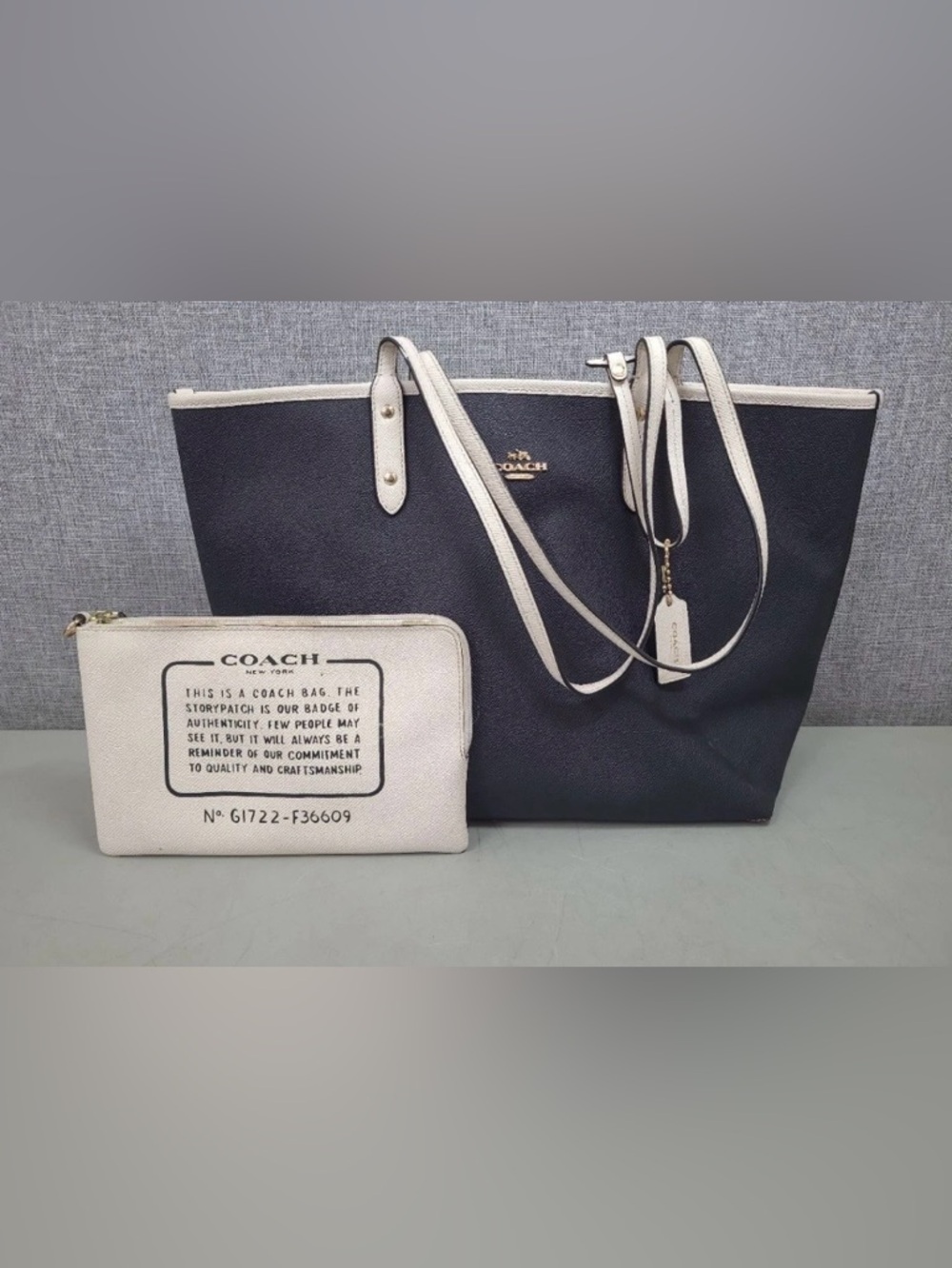 2 piece Coach Reversible Black Tote with Cream Trim and Matching Pouch